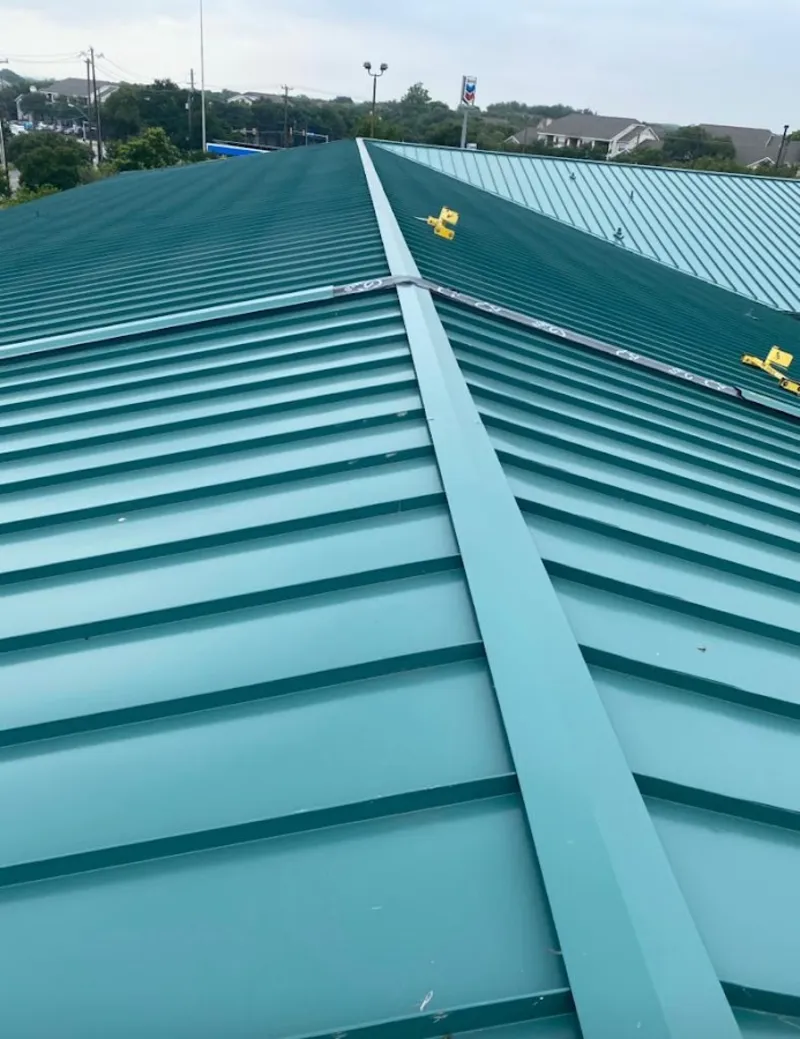 Green commercial metal roof ridge and valley for Metal Roof Repair in Inverness